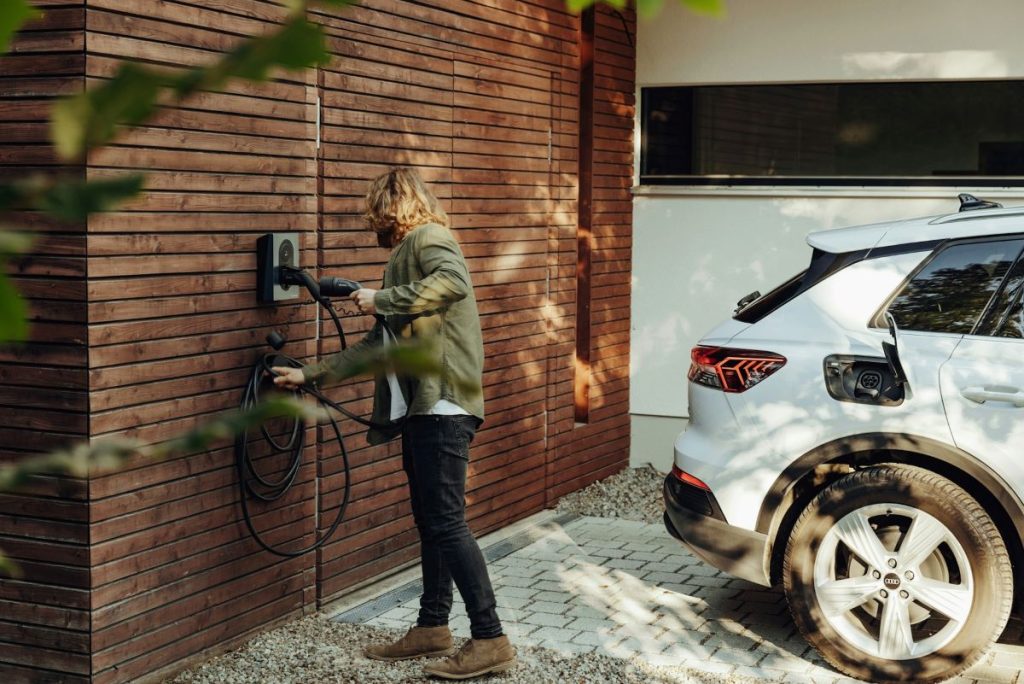 woman charging her ev car